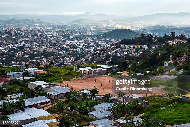 People play soccer in a field on the outskirts of Tegucigalpa, Honduras, on Tuesday, Sept. 3, 2013. Economic growth in Honduras is forecast to slow...