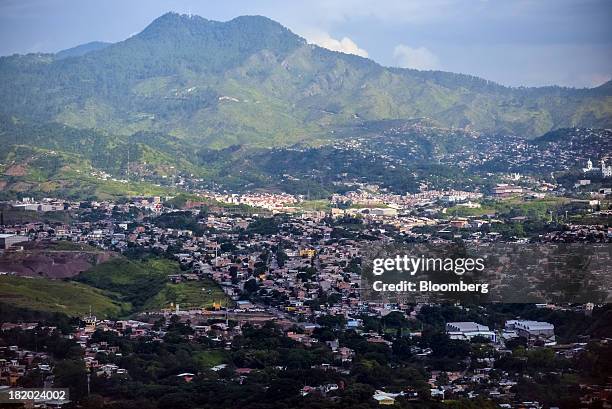 Mountains stand beyond the city in Tegucigalpa, Honduras, on Tuesday, Sept. 3, 2013. Economic growth in Honduras is forecast to slow to 3 percent...