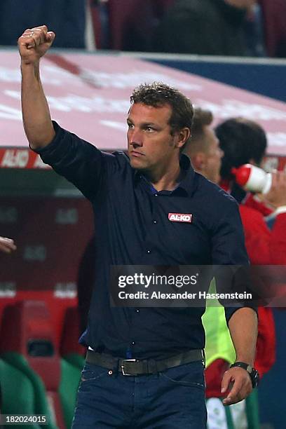 Markus Weinzierl, head coach of Augsburg celebrates his teams second goal during the Bundesliga match between FC Augsburg and Borussia...