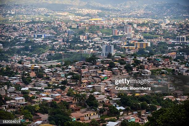 Houses stand in a favela in Tegucigalpa, Honduras, on Tuesday, Sept. 3, 2013. Economic growth in Honduras is forecast to slow to 3 percent this year...