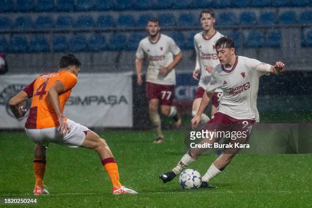 Jayce Fitzgerald of Manchester United is in action with Eren Pasahan of Galatasaray during the UEFA Youth League match between Galatasaray A.S. And...