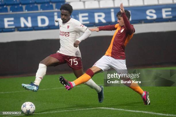 Habeeb Ogunneye of Manchester United is in action with Ali Yesilyurt of Galatasaray during the UEFA Youth League match between Galatasaray A.S. And...