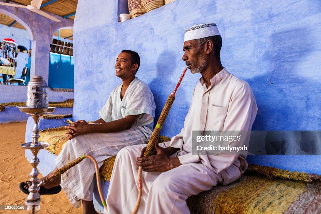 Nubian men smoking waterpipe in Southern Egypt