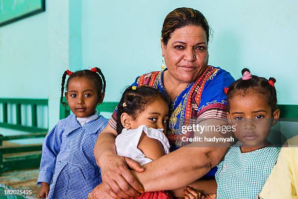teacher with goup of children in southern egypt - north africa stock pictures, royalty-free photos & images