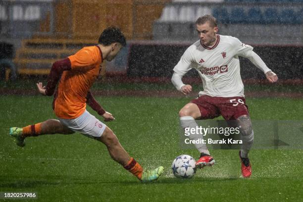 Isak Hansen-Aareen of Manchester United is in action with Eren Pasahan of Galatasaray during the UEFA Youth League match between Galatasaray A.S. And...