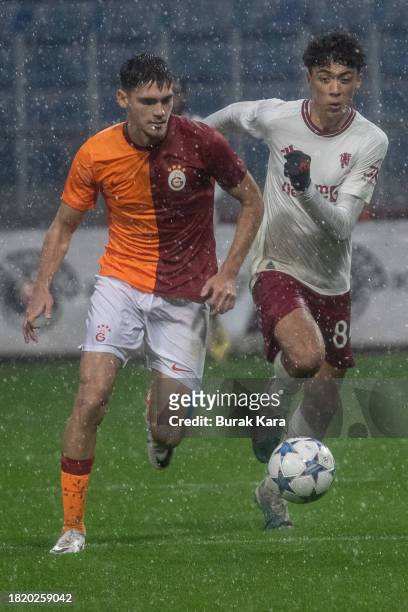 Ethan Wheatley of Manchester United is in action with Ali Turalp Bulbul of Galatasaray during the UEFA Youth League match between Galatasaray A.S....