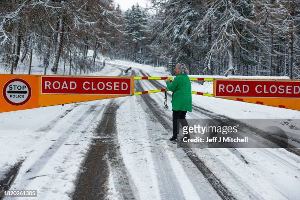 Road Closed sign on the A939 between Corgarff and the Lecht on November 29, 2023 in Lecht Scotland. On Tuesday, the Met Office issued a warning for...