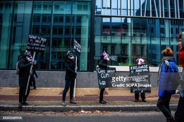 Group of vegan activists seen disguised as animals while holding placards in support of climate during the demonstration. Thousands of people...