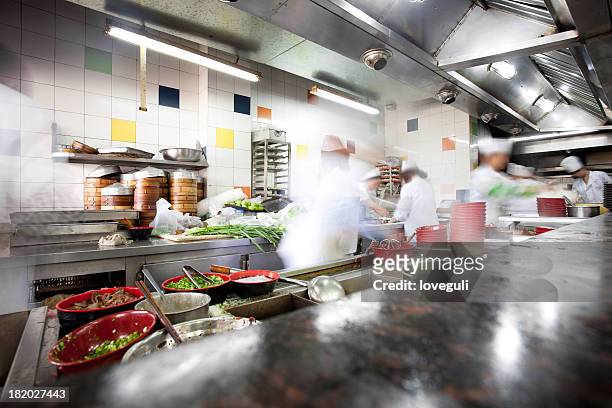 busy kitchen - blurred motion restaurant stock pictures, royalty-free photos & images