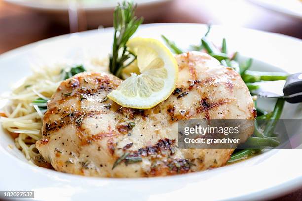 grilled chicken and pasta - lemon chicken stock pictures, royalty-free photos & images