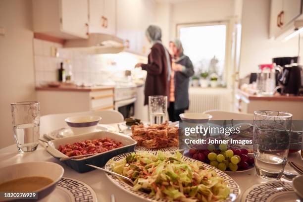 women preparing eid al-fitr at home - meal stock pictures, royalty-free photos & images