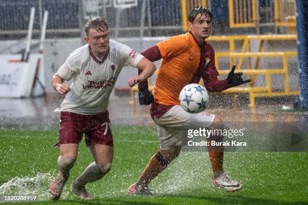 Yalin Dilek of Galatasaray is in action with James Nolan of Manchester United during the UEFA Youth League match between Galatasaray A.S. And...