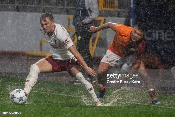 James Nolan of Manchester United is in action with Beknaz Almazbekov of Galatasaray during the UEFA Youth League match between Galatasaray A.S. And...