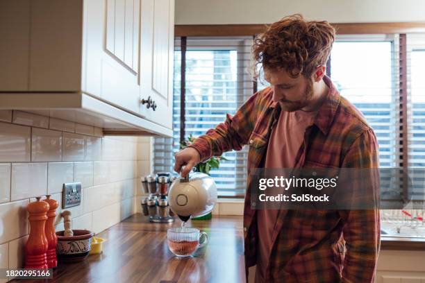 making a brew - boiling stock pictures, royalty-free photos & images
