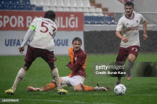 Yalin Dilek of Galatasaray James Nolanişs in action with Willy Kambwala of Manchester United during the UEFA Youth League match between Galatasaray...