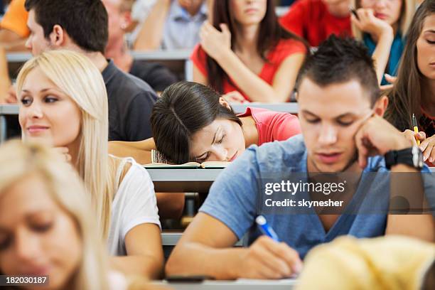 young female student sleeping during a lecture. - bored audience stock pictures, royalty-free photos & images