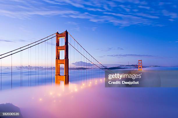golden gate bridge with fog san francisco - golden gate stock pictures, royalty-free photos & images