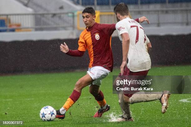 Jack Kingdon of Manchester United is in action with Berk Kizildemir of Galatasaray during the UEFA Youth League match between Galatasaray A.S. And...