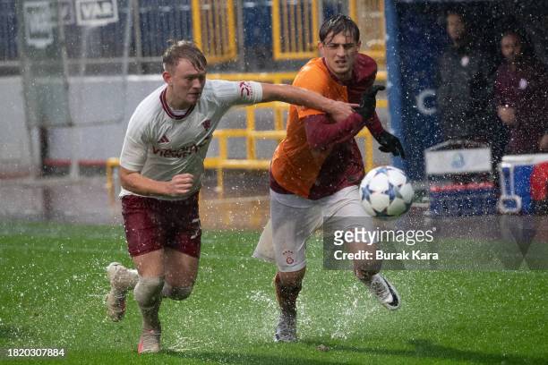 Yalin Dilek of Galatasaray is in action with James Nolan of Manchester United during the UEFA Youth League match between Galatasaray A.S. And...