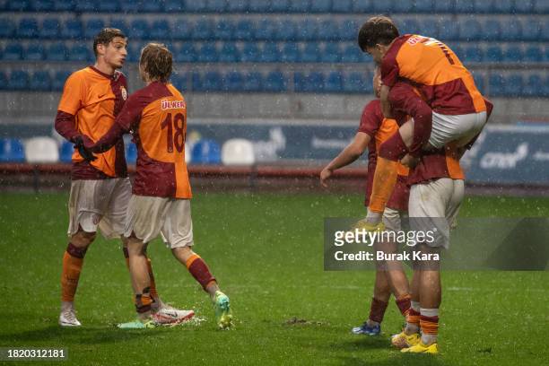 Galatasaray players celebrate their win against Manchester United during the UEFA Youth League match between Galatasaray A.S. And Manchester United...