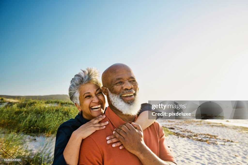 Active Mature African-American Couple Enjoying Retirement and Each Other’s Company at the Beach.
