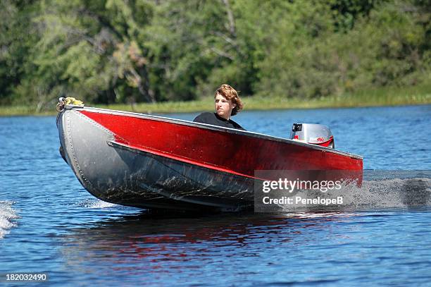 teen on the lake - silver boot stockfoto's en -beelden