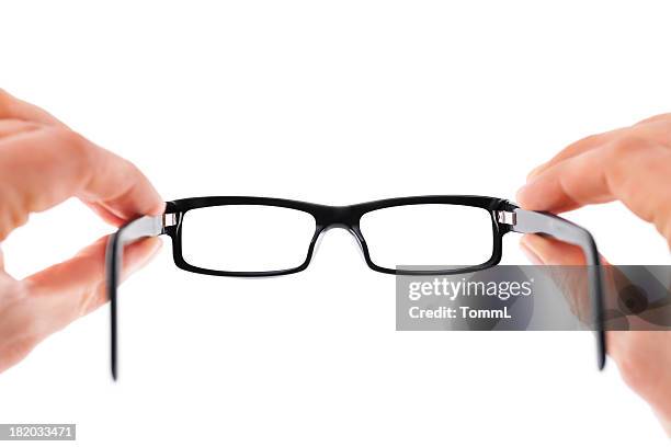 mani tenendo gli occhiali - occhiali da vista foto e immagini stock