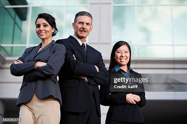 team of businesspeople standing outside office building - 3 men standing outside stockfoto's en -beelden