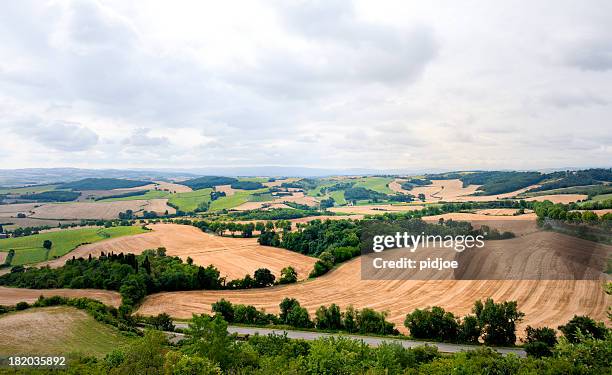 patchwork landscape at moody sky in france - aude stock pictures, royalty-free photos & images