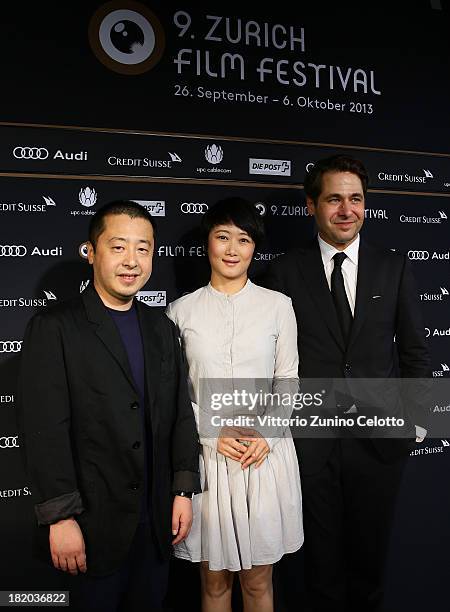 Jia Zhangke, Zhao Tao, Karl Spoerri attend 'A Touch Of Sin' Green Carpet during the 9th Zurich Film Festival on September 27, 2013 in Zurich,...