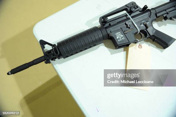 Gun modeled after an assault rifle is checked in during a state and county sponsored gun buyback at Sayre Woods Bible Church on September 27, 2013 in...