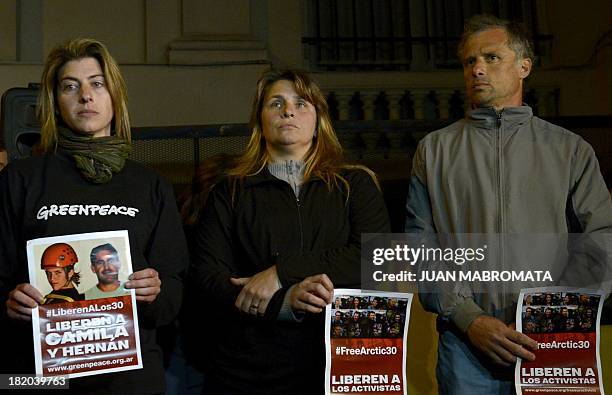 The sister of Greenpeace activist Hernan, and the parents of Camila attend a protest on September 27, 2013 in front of the Russian embassy in Buenos...