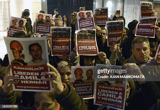 Greenpeace activists hold a protest on September 27, 2013 in front of the Russian embassy in Buenos Aires, demanding the release of activists from...