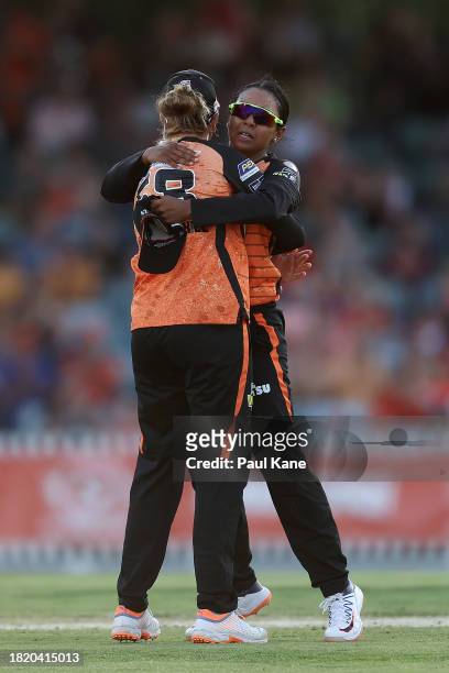 Lauren Winfield-Hill and Alana King of the Scorchers celebrates the wicket of Laura Harris of the Heat during The Challenger WBBL finals match...