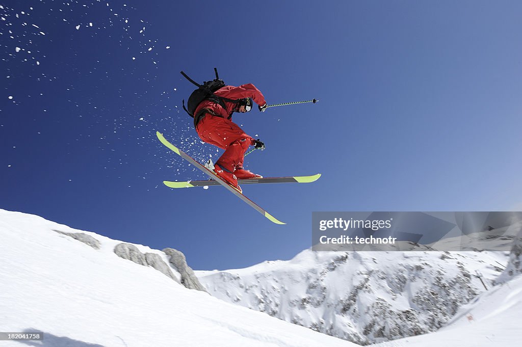 Extreme free ride skier in mid air