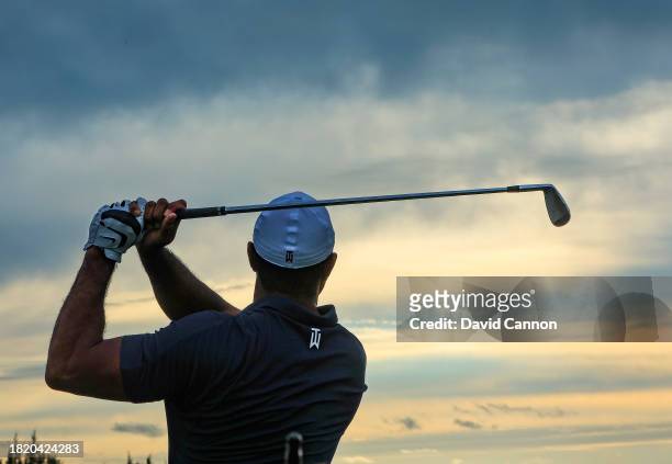 Tiger Woods of The United States warms up on the driving range prior to playing in the pro-am as a preview for the Hero World Challenge at Albany...