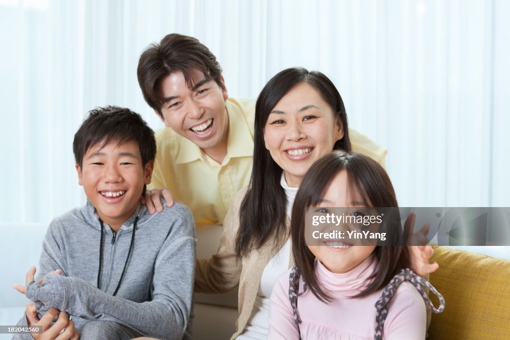 Portrait of Young Japanese Family in Their Home Interior