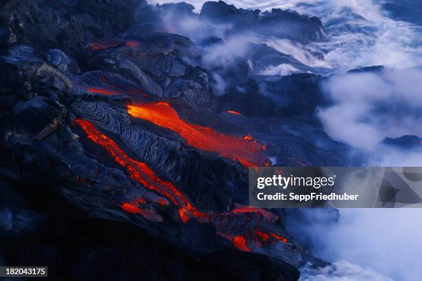 lava flow in hawaii flowing into the ocean - big island volcano national park stock pictures, royalty-free photos & images