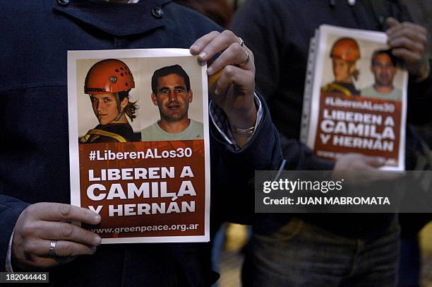 Greenpeace activists hold a protest on September 27, 2013 in front of the Russian embassy in Buenos Aires, demanding the release of activists from...