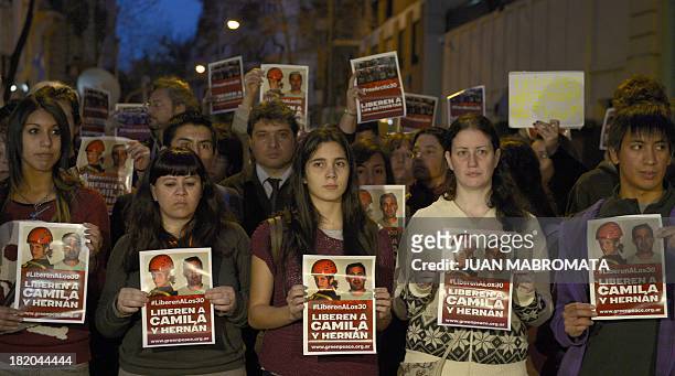 Greenpeace activists hold a protest on September 27, 2013 in front of the Russian embassy in Buenos Aires, demanding the release of activists from...