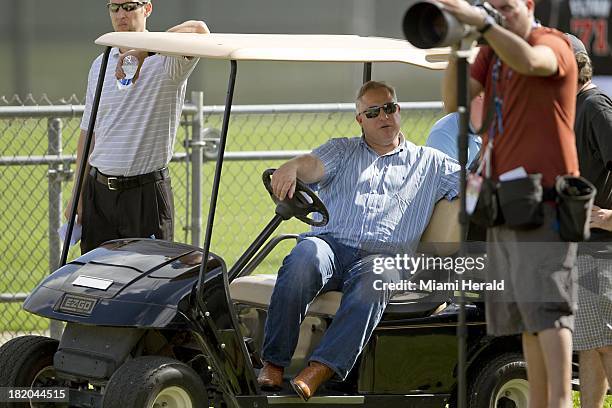 Larry Beinfest, the Miami Marlins' president of baseball operations, watches bullpen sessions in February 2013. Beinfest was fired after 12 seasons...