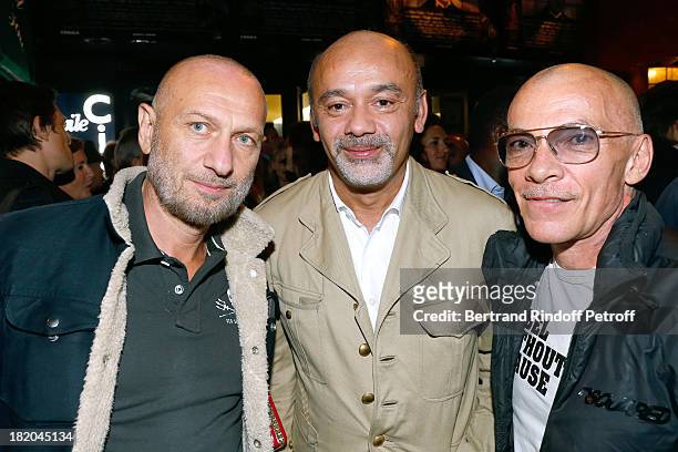 FAshion Designer Christian Louboutin between Photographers Pierre and Gilles attend 'Opium' movie Premiere, held at Cinema Saint Germain in Paris on...
