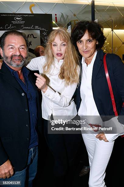 Director of the movie Arielle Dombasle between Fashion Designer Ines de la Fressange and President of Lagardere Active Denis Olivennes attend 'Opium'...
