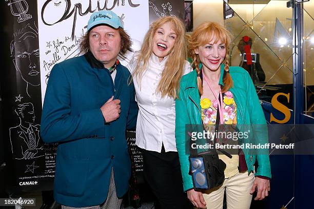 Director of the movie Arielle Dombasle between actors of the movie Julie Depardieu and companion Philippe Katerine attend 'Opium' movie Premiere,...