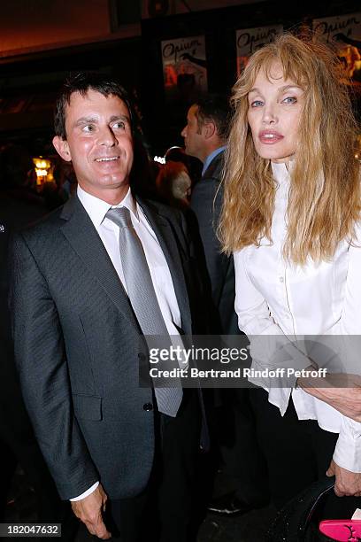 Minister of the Interior Manuel Valls and Director of the movie Arielle Dombasle attend the 'Opium' movie premiere, held at Cinema Saint Germain in...
