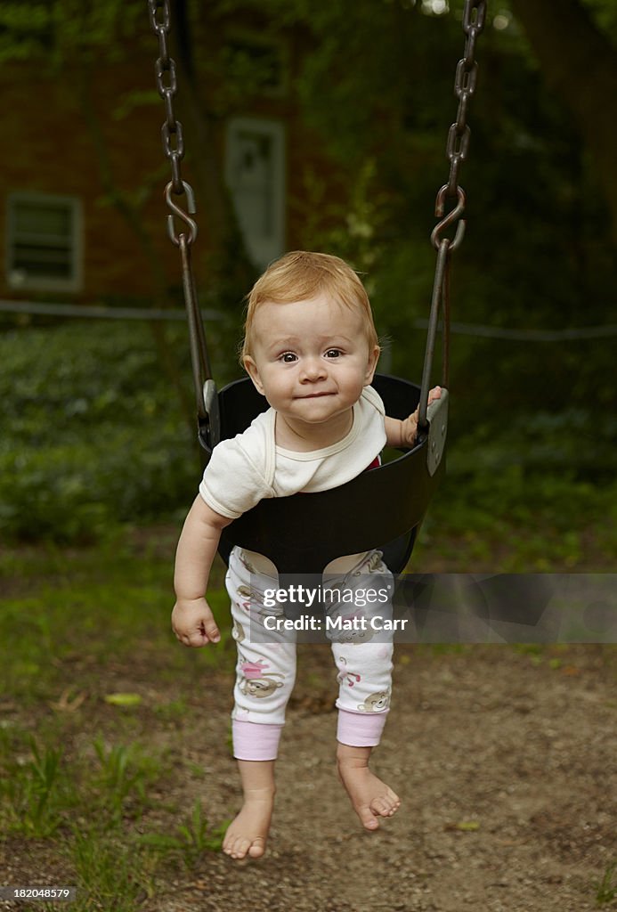 Baby girl on swing