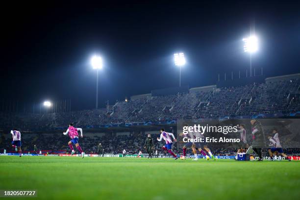 Barcelona players warm up prior to the UEFA Champions League match between FC Barcelona and FC Porto at Estadi Olimpic Lluis Companys on November 28,...