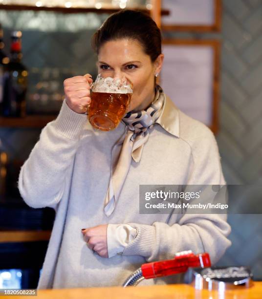 Crown Princess Victoria of Sweden sips a pint of beer she pulled as she visits the Three Blackbirds Pub, Woodditton to meet a pub owner to discuss...