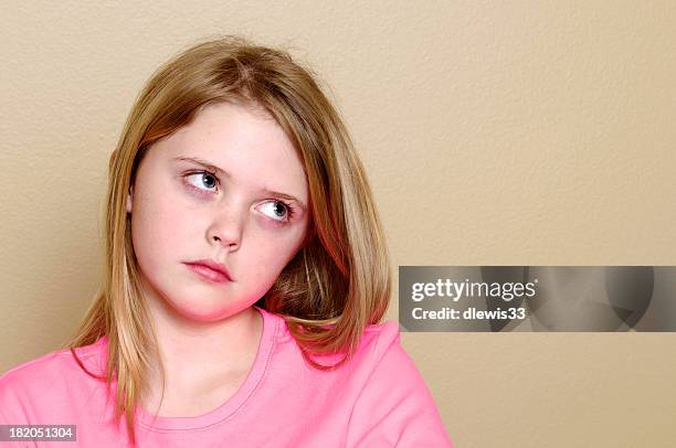 adorable little girl rolling her eyes - rollen met de ogen stockfoto's en -beelden