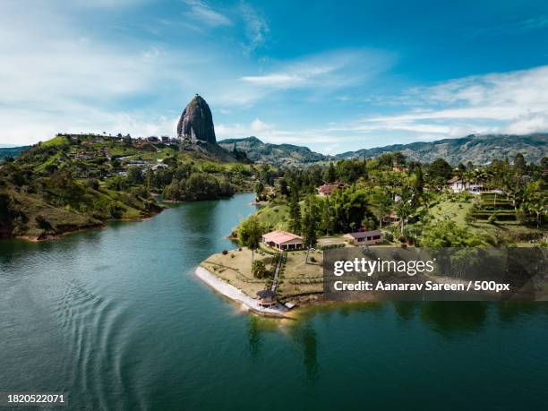 scenic view of lake against sky - medellin colombie photos et images de collection